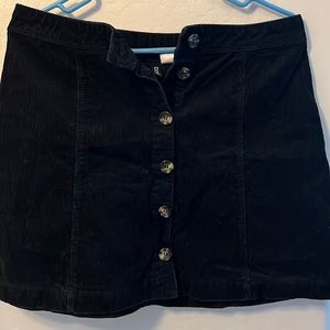 Black corduroy, button front, short skirt. Size 10. Good condition. Smoke free